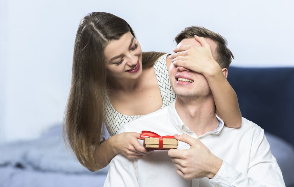 woman-with-gift-covering-man-eyes.jpg woman-with-gift-covering-man-eyes.jpg